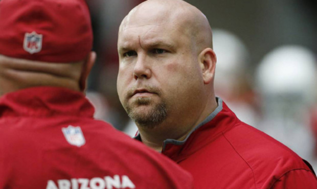 Arizona Cardinals general manager Steve Keim, right, talks with Cardinals head coach Bruce Arians d...