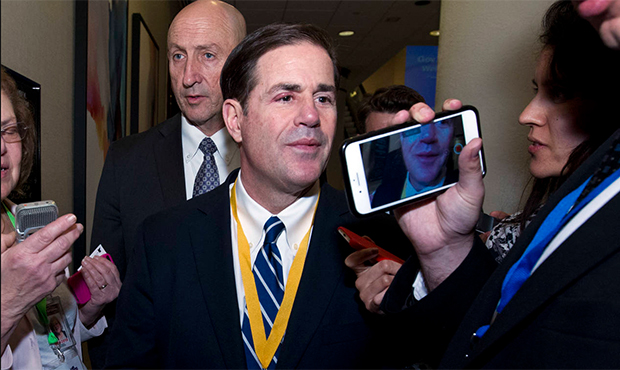 Gov. Doug Ducey of Arizona speaks with reporters during the National Governor Association 2018 wint...