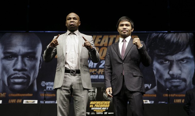 In this March 11, 2015, file photo, boxers Floyd Mayweather Jr., left, and Manny Pacquiao, of the P...