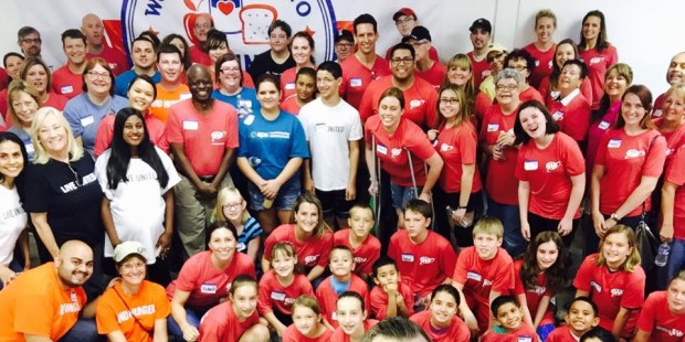 Volunteers are shown after putting together more than 1,200 food packs for Arizona children. (Faceb...
