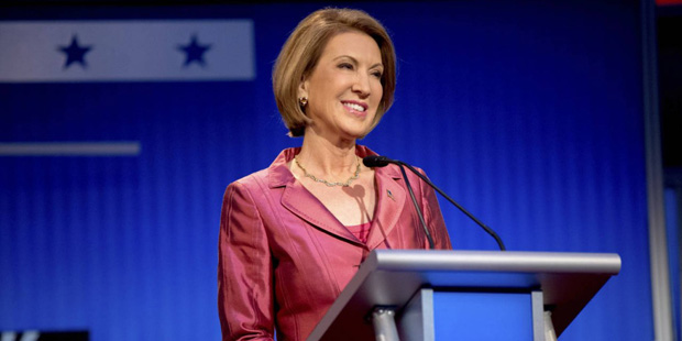 Republican presidential candidate businesswoman Carly Fiorina stands on stage for a pre-debate foru...