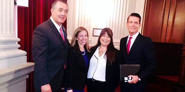 Rep. Trent Franks (R-Ariz.), at left, presents Arizona 1.27 with the congressional Angels in Adopti...
