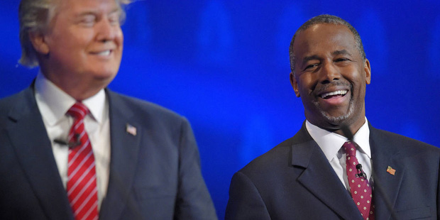 Ben Carson, right, and Donald Trump laugh together during the CNBC Republican presidential debate a...