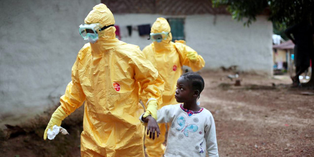 In this Tuesday, Sept. 30, 2014 file photo, Nine-year-old Nowa Paye is taken to an ambulance after ...