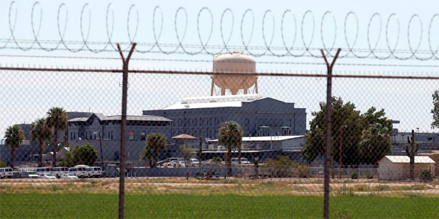 In this July 23, 2014, file photo, a fence surrounds the state prison in Florence, Arizona. (AP Pho...