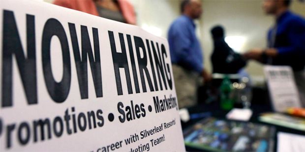 In this Thursday, Oct. 25, 2012, file photo, a sign attracts job-seekers during a job fair at the M...