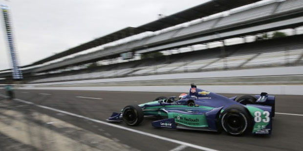 In this May 14, 2015, photo, Charlie Kimball pulls into the pits during practice for the Indianapol...