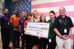 Congresswoman Sinema presents a $35,000 check to Wounded Warrior Project in Phoenix. (Photo: Kyrsten Sinema for Congress)