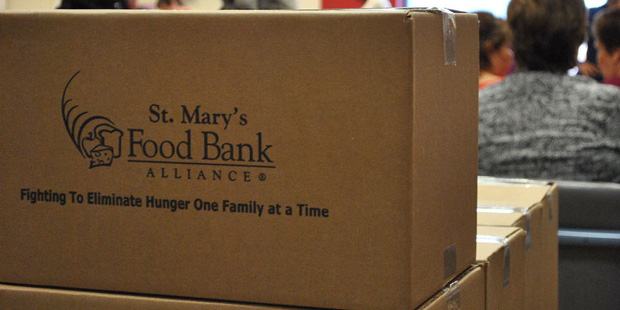 St. Mary's Food Bank giving to those in need. (Photo: Erin Johnson/Cronkite News)...