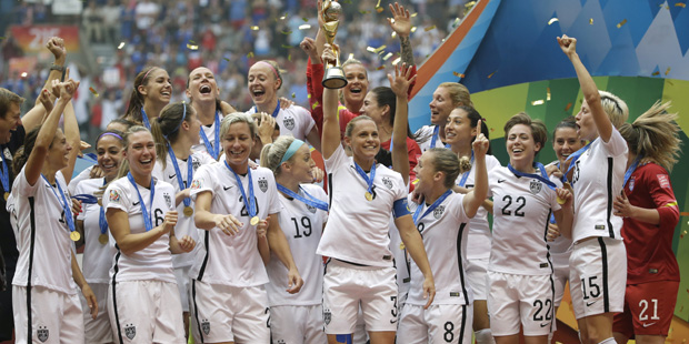 The United States Women's National Team celebrates with the trophy after they beat Japan 5-2 in the...