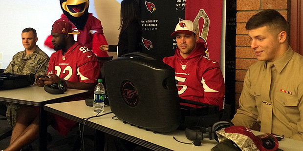 Arizona Cardinals defensive end Frostee Rucker (second from left) and backup quarterback Drew Stant...