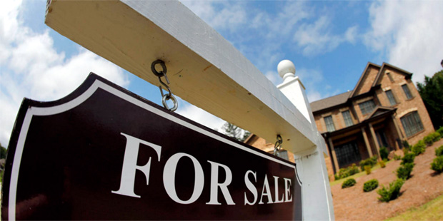 This June 4, 2015, file photo, shows a sign in front of a home for sale in Roswell, Ga. (AP Photo/J...