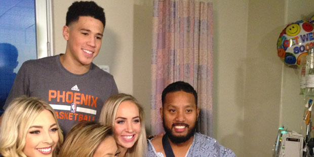 Phoenix Suns guard Devin Booker visits with a patient at St. Luke’s Medical Center. Related Trump...