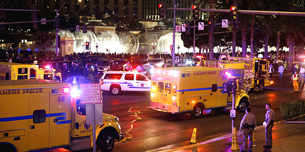 Police and emergency crews respond to the scene of a car accident along Las Vegas Boulevard, Sunday...