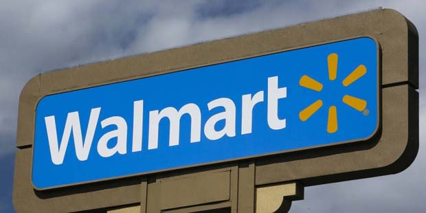FILE - This May 28, 2013, file photo shows signage outside a Wal-Mart store in Duarte, Calif.  Wal-...