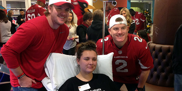 Arizona Cardinals kicker Chandler Cantanzaro (left) and punter Drew Butler visit with a patient at ...