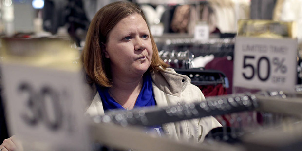 In this photo taken Saturday, Nov. 28, 2015, Janae Melvin shops for gifts at Forever 21 in Kansas C...