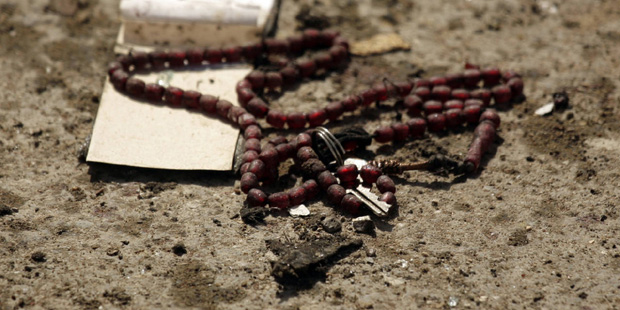 In this Wednesday, Oct. 8, 2008 file photo, prayer beads are seen at the site after a female suicid...
