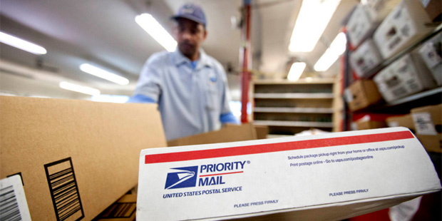 In this Feb. 7, 2013 file photo, packages wait to be sorted in a Post Office in Atlanta. (AP Photo/...