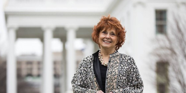 Sue Ellen Allen of Scottsdale, Ariz., poses for photographs in front of the White House in Washingt...