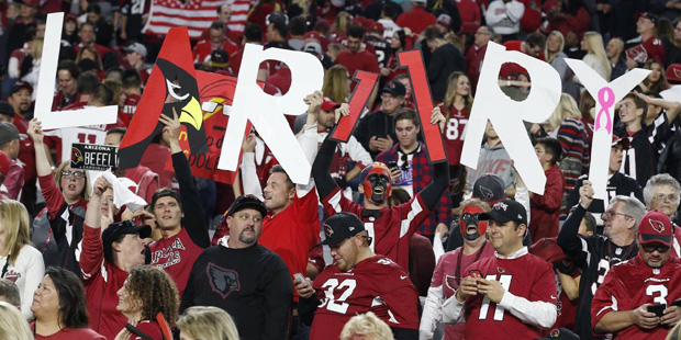 Arizona Cardinals fans hold a "Larry" sign in support of Arizona Cardinals wide receiver Larry Fitz...