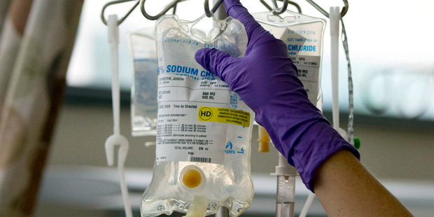 In this Tuesday, Aug. 4, 2015 file photo, a nurse places a patient's chemotherapy medication on an ...