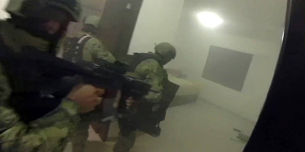 This frame-grab taken from Jan. 8, 2016 video released by Mexico's presidential press office, shows...