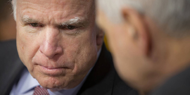 Senate Armed Services Committee Chairman Sen. John McCain, R-Ariz., left, talks committee's ranking...