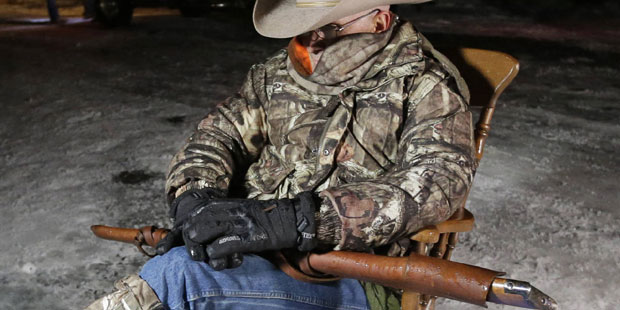 Arizona rancher LaVoy Finicum, holds as he guards the Malheur National Wildlife Refuge, Tuesday, Ja...