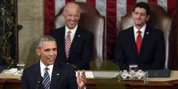 Vice President Joe Biden and House Speaker Paul Ryan of Wis., listen as President Barack Obama give...