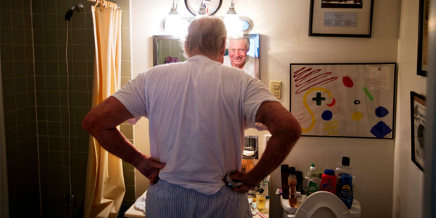 In this photo taken Aug. 27, 2015, John Jay Hooker stretches in his bathroom as he gets ready for t...