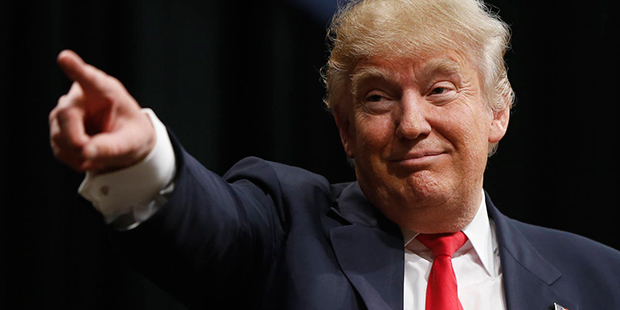 Republican presidential candidate Donald Trump gestures during a campaign stop, Friday, Feb. 19, 20...