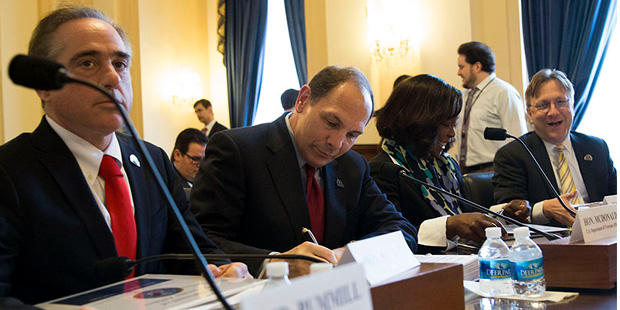 VA Secretary Robert McDonald, center, at a House Veterans Affairs Committee hearing where he told l...