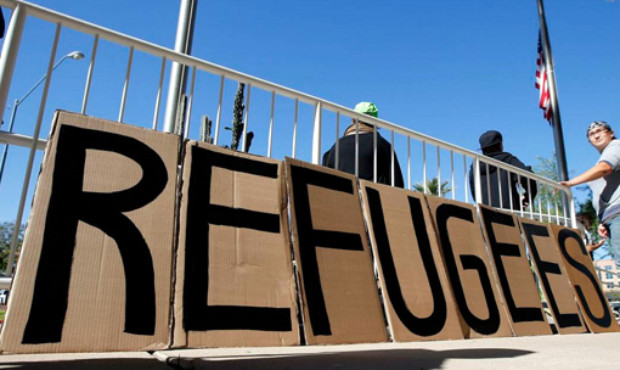 A sign welcoming Syrian refugees is placed at the entrance to the office of the Arizona governor du...
