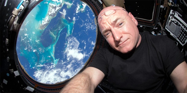 This July 12, 2015 photo made available by NASA, astronaut Scott Kelly poses for a selfie photo in ...