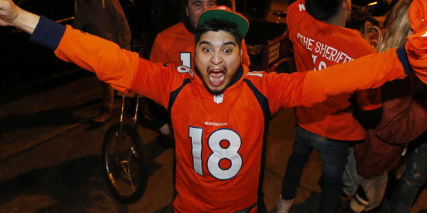 Denver Broncos fans celebrate the team's victory over the Carolina Panthers in Super Bowl 50 near i...