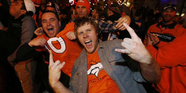 Denver Broncos fans celebrate the team's victory over the Carolina Panthers in Super Bowl 50 near i...