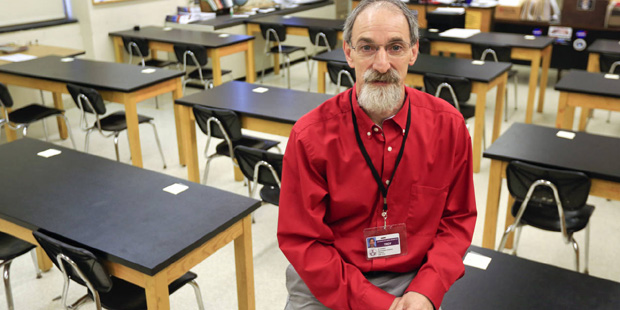 Teacher Seth Cohen poses in a classroom at Troy High School on Wednesday, Dec. 16, 2015, in Troy, N...