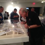 KEN KENDRICK LOOKING AT HIS EXHIBIT