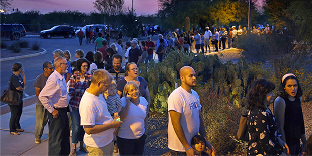 People wait in line to vote in the primary at the Environmental Education Center, Tuesday, March 22...