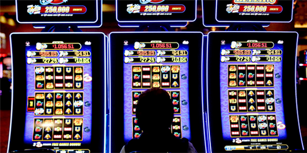 In this photo taken Friday, Jan. 15, 2016, a woman plays a slot machine at the Ameristar Casino in ...
