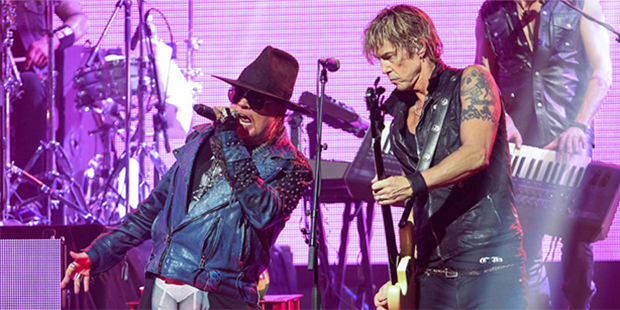 FILE - In this April 23, 2014 file photo, Axl Rose, left, and Duff McKagan of Guns N' Roses perform...