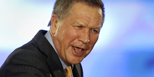 Republican presidential candidate, Ohio Gov. John Kasich pumps his fist before speaking at his pres...