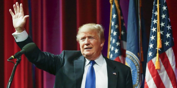 Republican presidential candidate Donald Trump acknowledges the crowd at his rally inside  Century ...