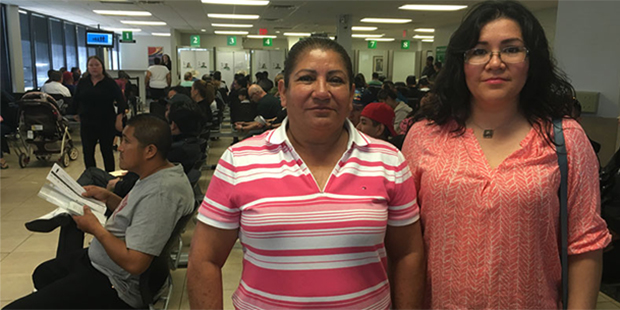 Minerva Perez, left, and Monica Soto wait in line at the Mexican consulate. Soto, who has been in t...