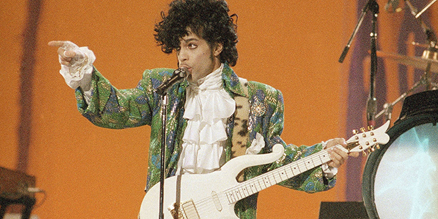 Singer Prince performs at the American Music Awards in Los Angeles, Jan. 28, 1985. (AP Photo/Doug P...