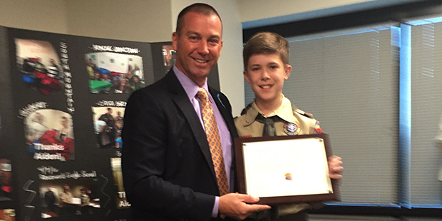 Aidan McClendon with Arizona DCS Director Greg McKay. (KTAR Photo/Brian Rackham)...