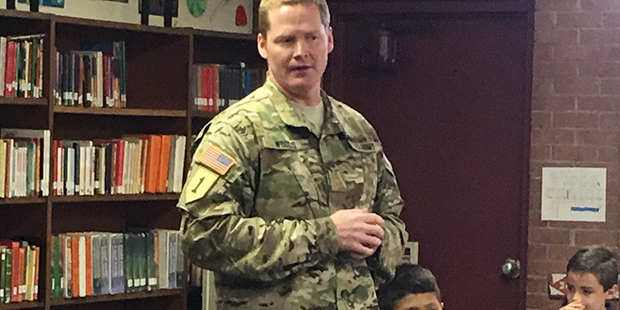 Major Tim Woods talks to schoolchildren about his experiences in combat and his message of patrioti...