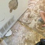 Student on floor next to rubble