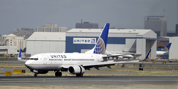 FILE - In this Sept. 9, 2015 file photo, a United Airlines passenger plane lands at Newark Liberty ...